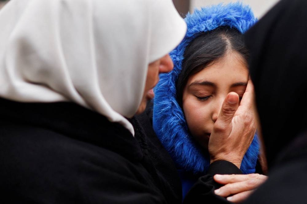Mourners react following the death of Palestinians in Israeli strikes in Rafah on Friday. REUTERS