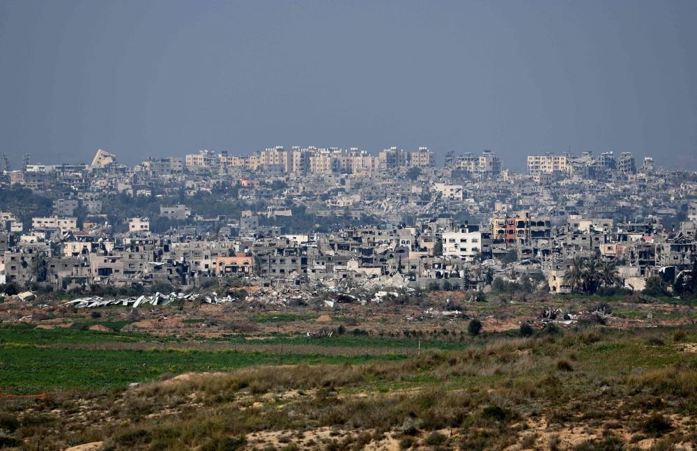 A picture taken from southern Israel shows destroyed buildings in the Gaza Strip on Friday. AFP