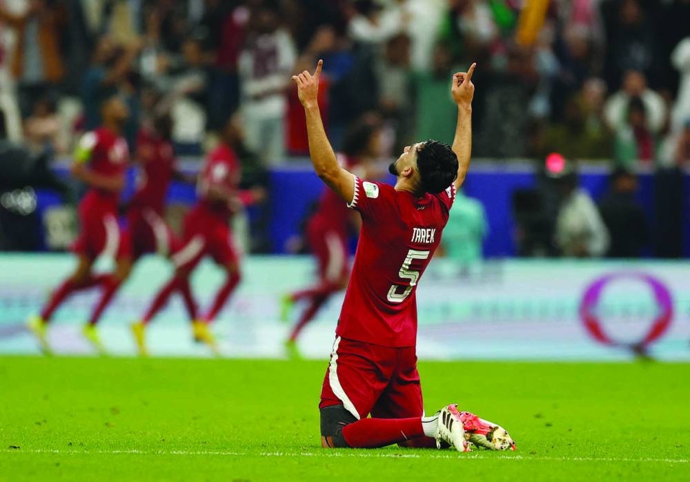 
Qatar’s Tarek Salman celebrates after Akram Afif scores their second goal. (Reuters) 