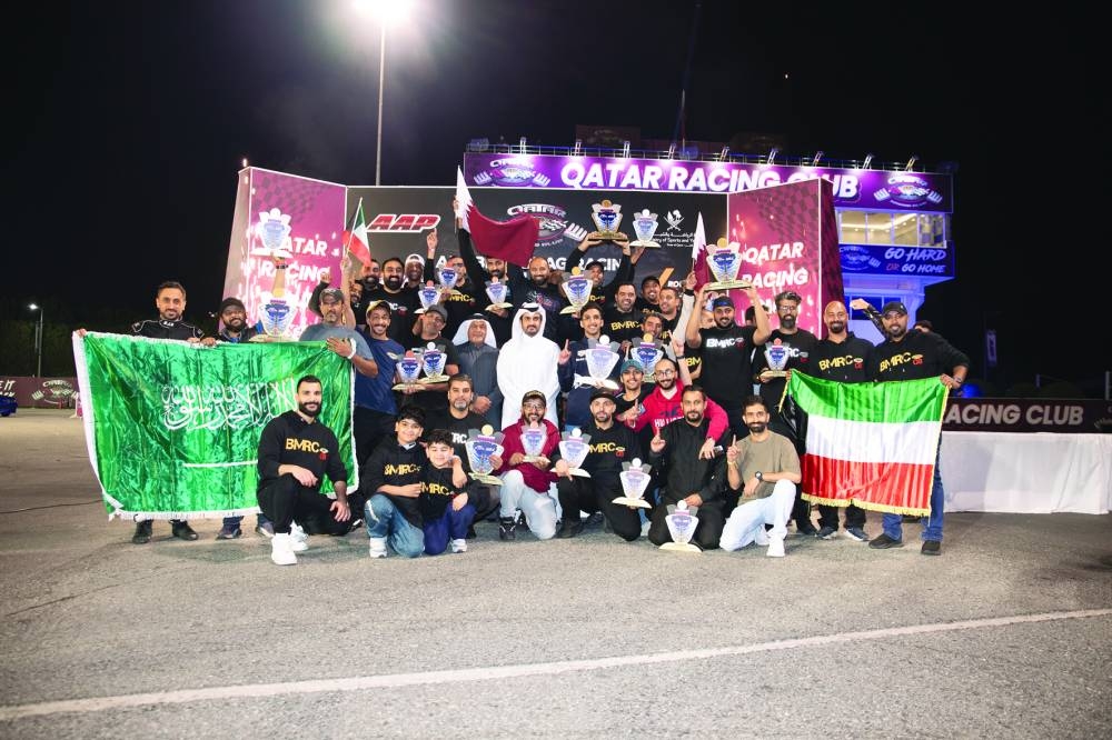 
All the winners of the fourth round of the Arabian Drag Racing League pose with Director of Qatar Racing Club Sheikh Jabor bin Khalid al-Thani. 