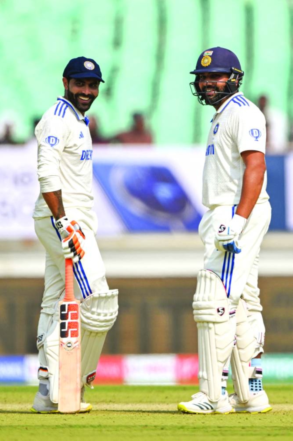 India’s Ravindra Jadeja (left) with captain Rohit Sharma during the first day of the third Test against England in Rajkot on Thursday. (AFP)