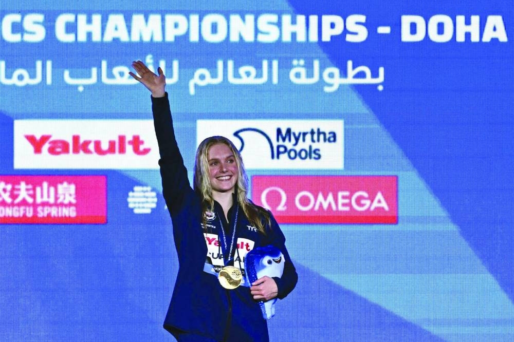 US gold medallist Claire Curzan poses on the podium of the women’s 50m backstroke swimming event during the 2024 World Aquatics Championships at Aspire Dome in Doha on Thursday. (AFP)