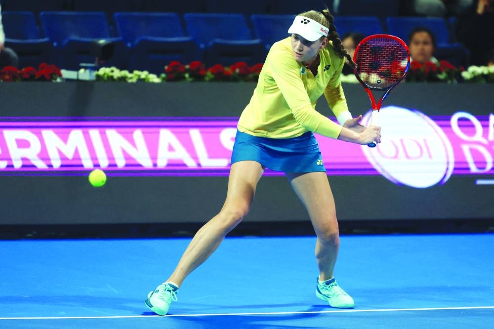 Kazakhstan’s Elena Rybakina hits a backhand during her match against Canada’s Leylah Fernandez at the Qatar TotalEnergies Open in Doha on Thursday. (AFP)