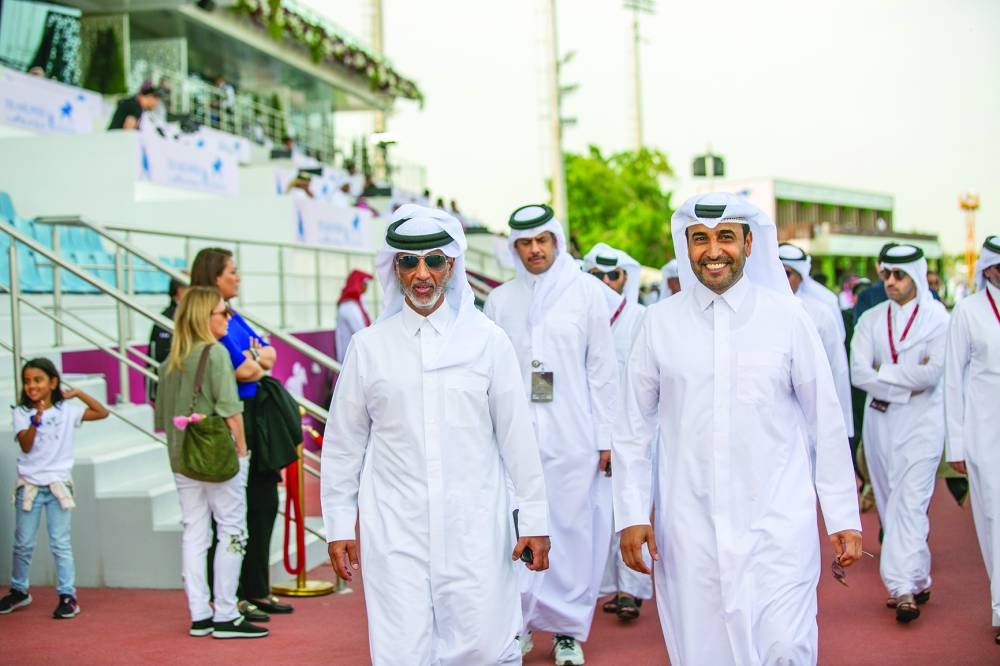 
HE Sheikh Hamad bin Khalifa bin Ahmed al-Thani, the Minister of Sports and Youth, and Issa bin Mohamed al-Mohannadi, QREC chairman, arrive at the Qatar Racing and Equestrian Club for the day one of the HH The Amir Sword Festival. PICTURES: Juhaim
 