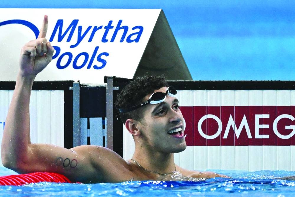 Spain’s Hugo Gonzalez celebrates after winning the final of the men’s 200m backstroke on Friday. (AFP)