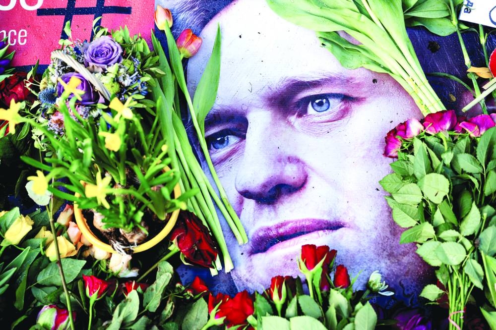 Flowers are laid outside the Russian embassy, following the death of Russian opposition leader Alexei Navalny, in Copenhagen, Denmark, on Saturday.  (Reuters)