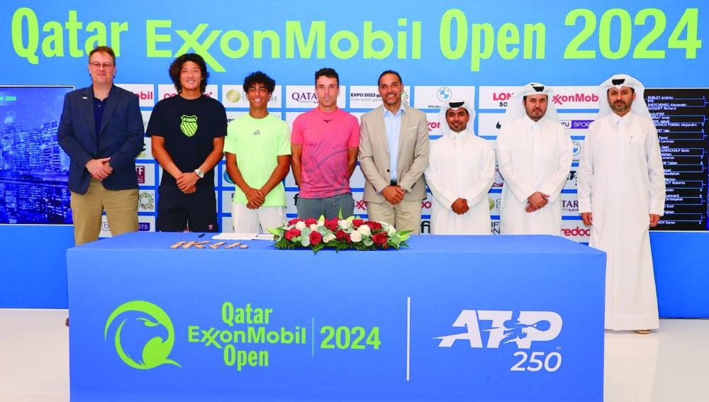 Roberto Bautista Agut of Spain, Qatar ExxonMobil Open champion in 2019 and 2022, Tournament Director Karim Alami, players Zhizhen Zhang of China and Abdullah Shelbayh of Jordan, Qatar ExxonMobil officials, QTF Executive Director Saad al-Mohannadi and ATP Supervisor Roland Herfel pose after the draw ceremony at the Khalifa International Tennis & Sports Complex on Saturday.