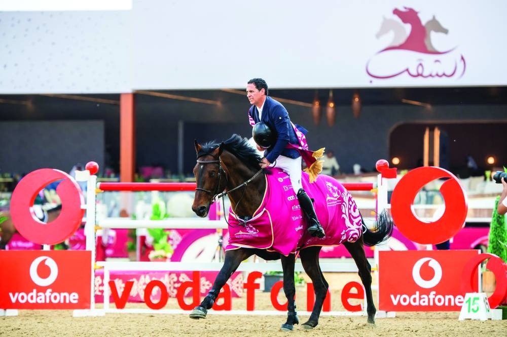 
Brazil’s Santiago Lambre celebrates with stallion Chacco Blue II after his victory. 