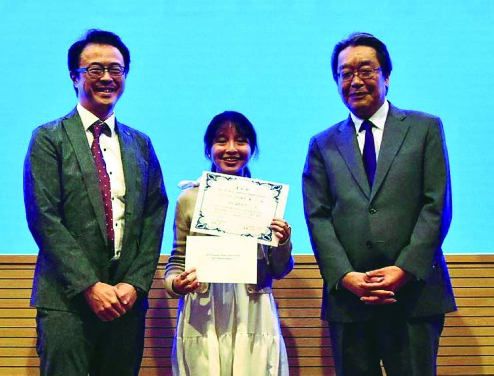 Winner Javannah Nonato with ambassador Satoshi Maeda (right) and another dignitary.