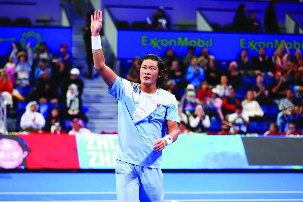 China’s Zhizhen Zhang celebrates beating Lorenzo Musetti of Italy on day one of the Qatar ExxonMobil Open in Doha on Monday. Zhang became the first Chinese man to win a main draw match in Doha.