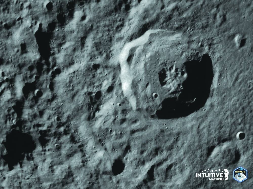 This February 21 photo courtesy of Intuitive Machines shows an image by the Odysseus’s Terrain Relative Navigation camera of the Bel’kovich K crater in the Moon’s northern equatorial highlands as the lunar lander prepares for its landing.