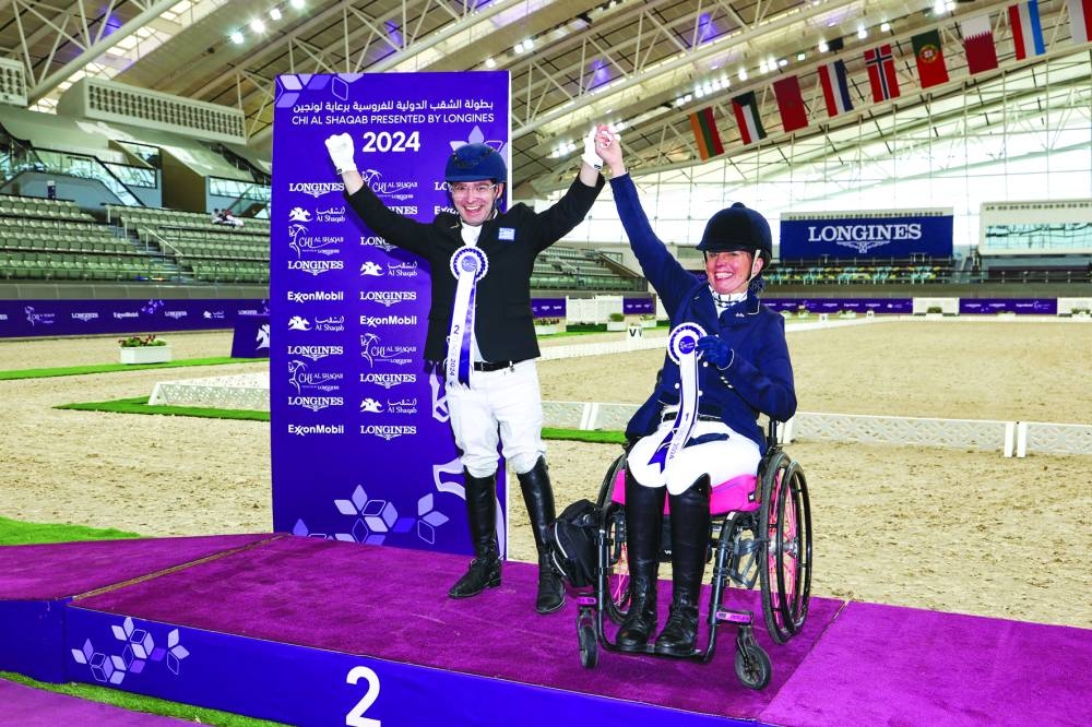 
Para-Dressage winners celebrate on the podium. 