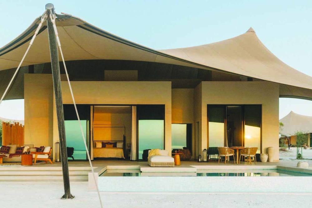 The resort's one-to-four-bedroom villas, each with private pools and large outdoor decks, overlook the Arabian Gulf.