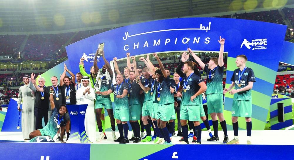 Team Chunkz celebrates after receiving the trophy from Qatar Tourism chairman Saad bin Ali al-Kharji. PICTURE: Shaji Kayamkulam