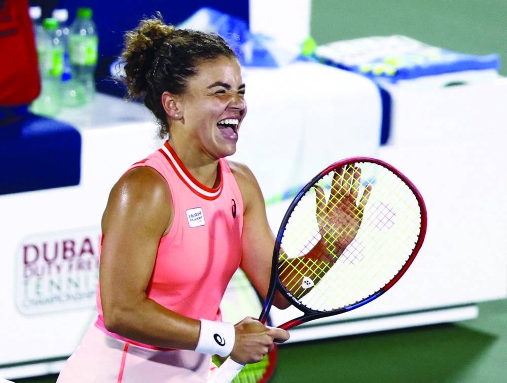 Italy’s Jasmine Paolini celebrates after winning her semi-final against Romania’s Sorana Cirstea at the Dubai Tennis Championships on Friday. (Reuters)