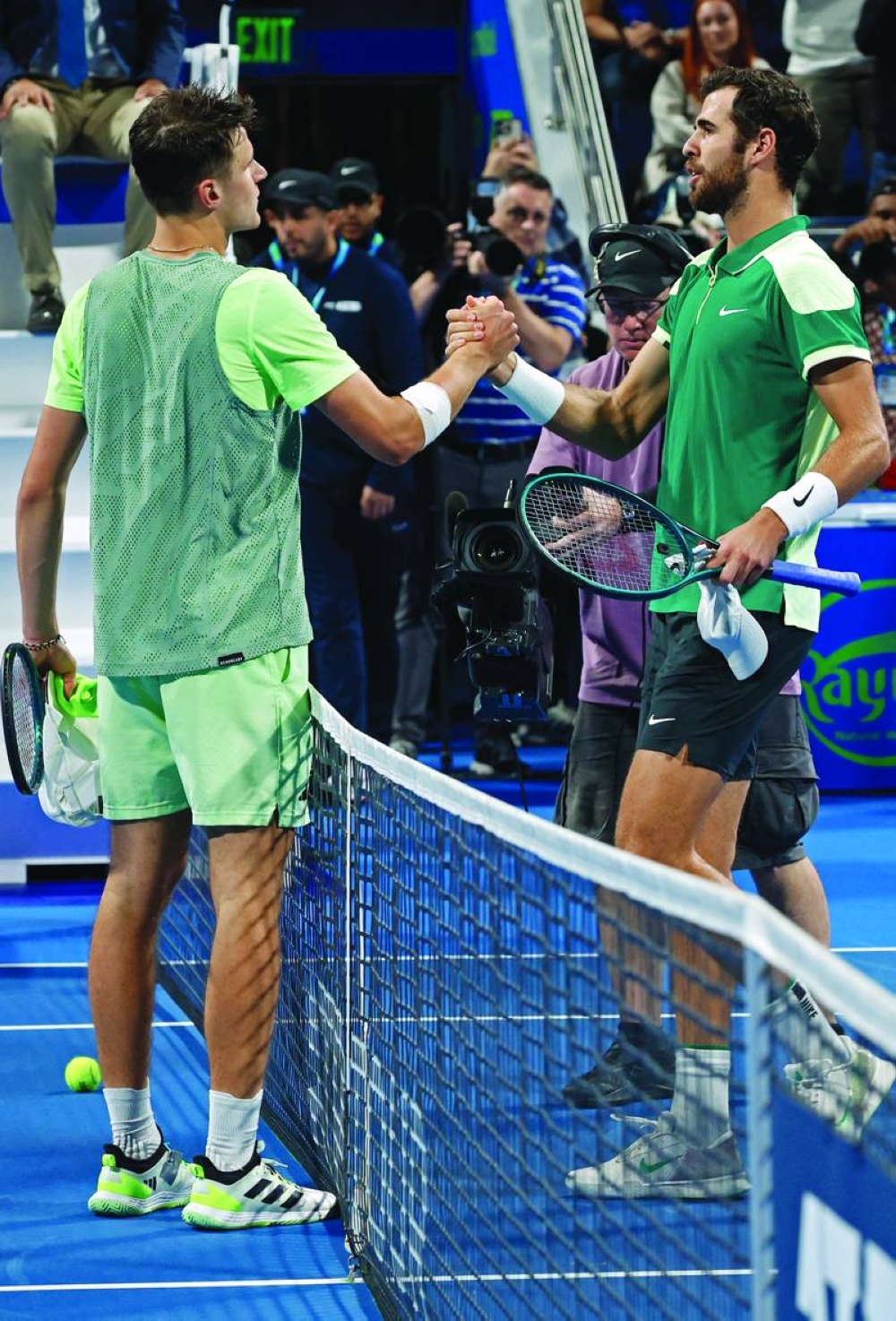 Russia’s Karen Khachanov (right) shakes hands with Czech Republic’s Jakub Mensik after winning the final in Doha on Saturday. (AFP)
