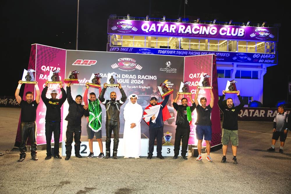All the winners of Arabian Drag Racing League (ADRL) celebrate with the Sheikh Jabor bin Khaled al-Thani, Director of Qatar Racing Club.