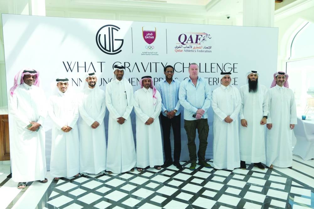 Qatar Athletics Federation President Mohamed Issa al-Fadala, High Jump stars Mutaz Barshim, Javier Sotomayor and Patrik Sjoberg pose with other officials yesterday.