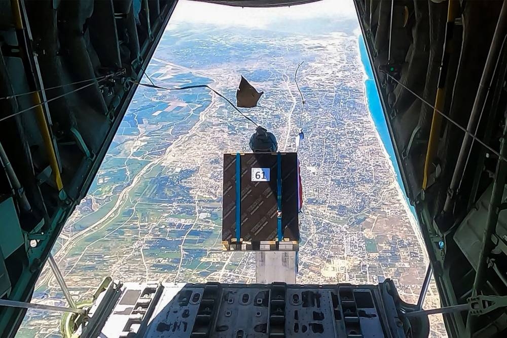 Humanitarian aid being dropped from a military aircraft over northern Gaza on Thursday. AFP/ JORDANIAN ARMY 