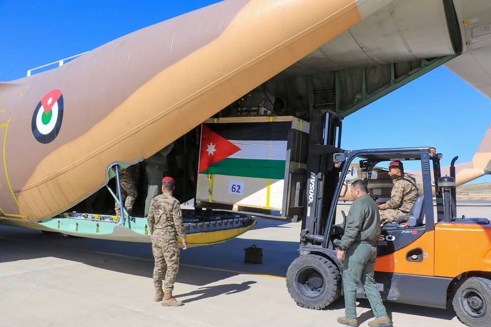 Humanitarian aid destined for the Gaza Strip being loaded onto a military aircraft at undisclosed location in Jordan on Thursday. AFP/ JORDANIAN ARMY 