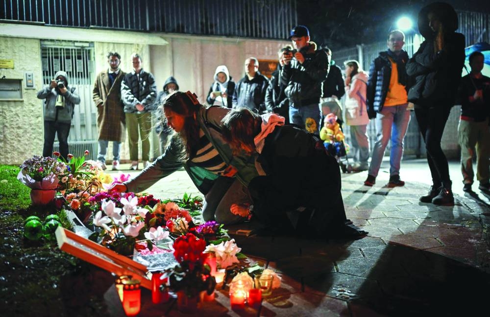 
People mourn at a makeshift memorial for Navalny in front of the 
Russian embassy in Sofia. 