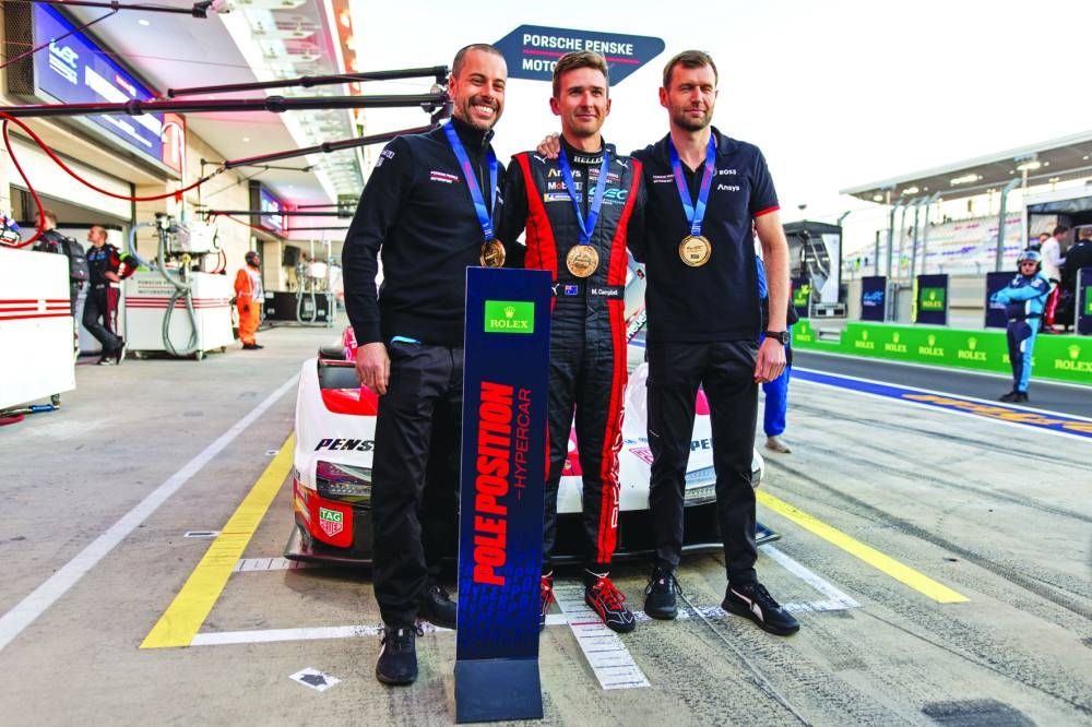 
Porsche Penske Motorsport’s Matt Campbell (centre) celebrates with teammates Michael Christensen and Frederic Makowiecki after securing pole position at the Lusail International Circuit. 