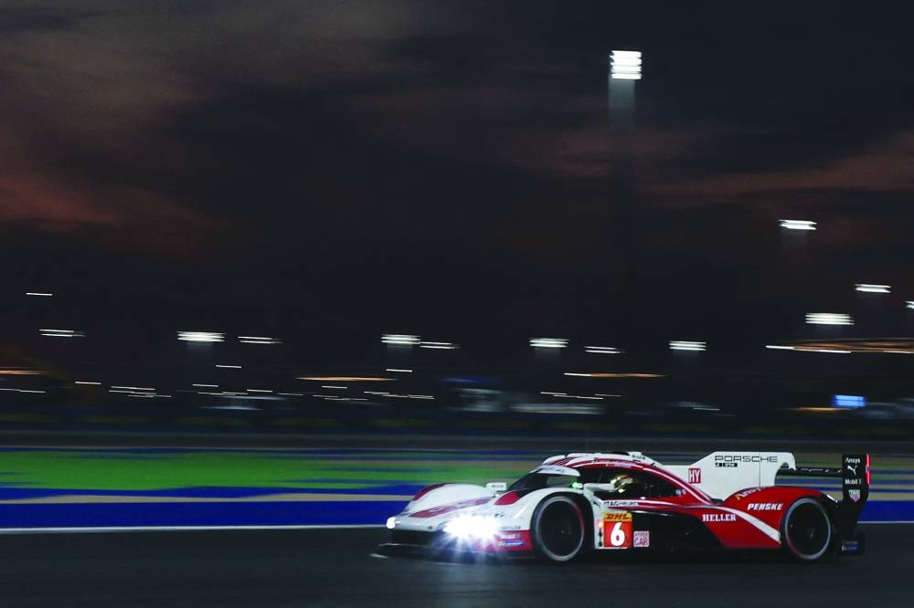 
Kevin Estre of Porsche Penske Motorsport drives under the lights at the Lusail circuit. 