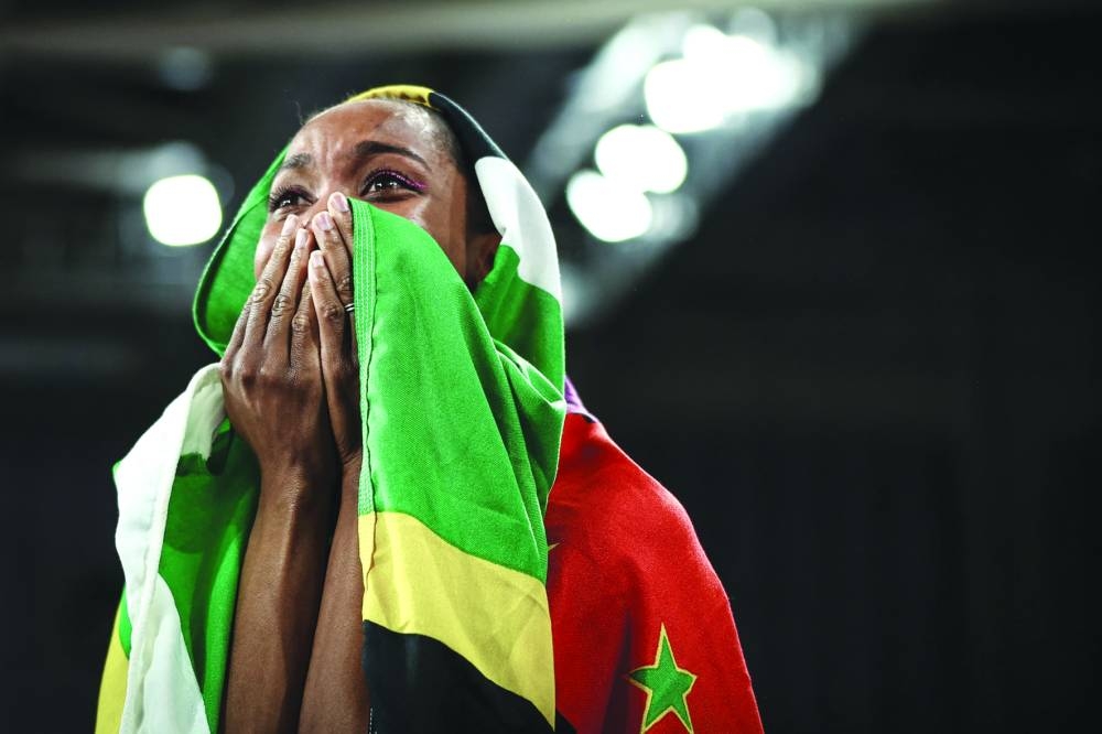 Dominica’s Thea Lafond celebrates after winning the Women’s Triple Jump final gold during the Indoor World Athletics 
Championships in Glasgow, Scotland, on Sunday. (AFP)