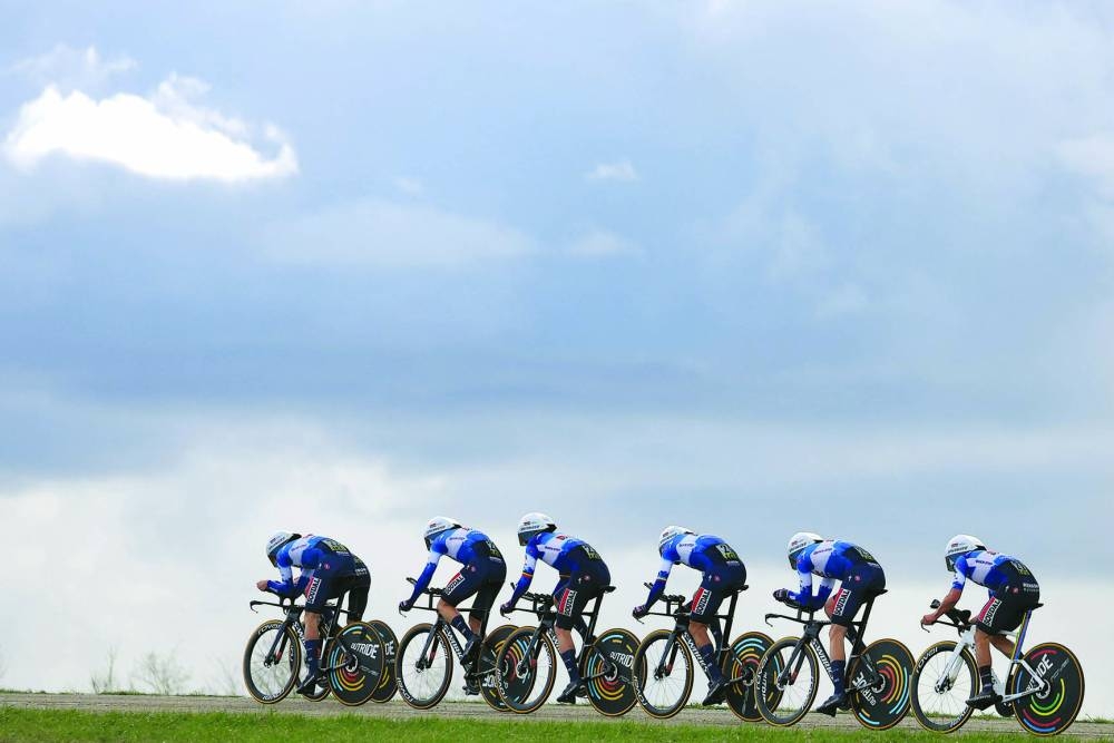 Soudal Quickstep’s team competes during the 3rd stage of the Paris-Nice cycling race, covering a distance of 26.9kms team time trial between Auxerre and Auxerre, on Tuesday. (AFP)