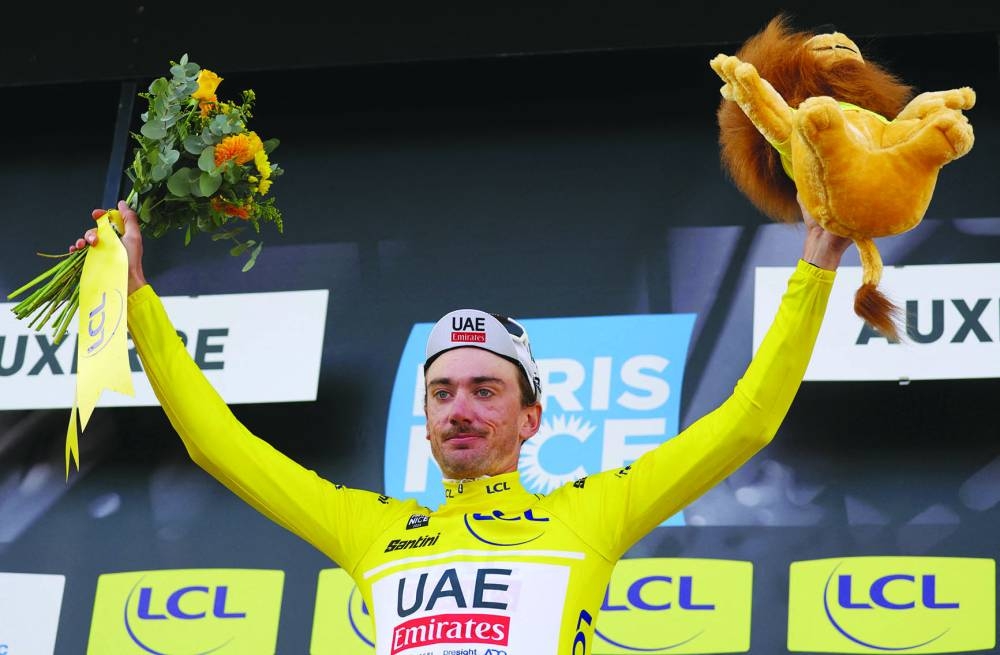 UAE Team Emirates’ US cyclist Brandon McNulty celebrates his overall leader yellow jersey on Tuesday. (AFP)