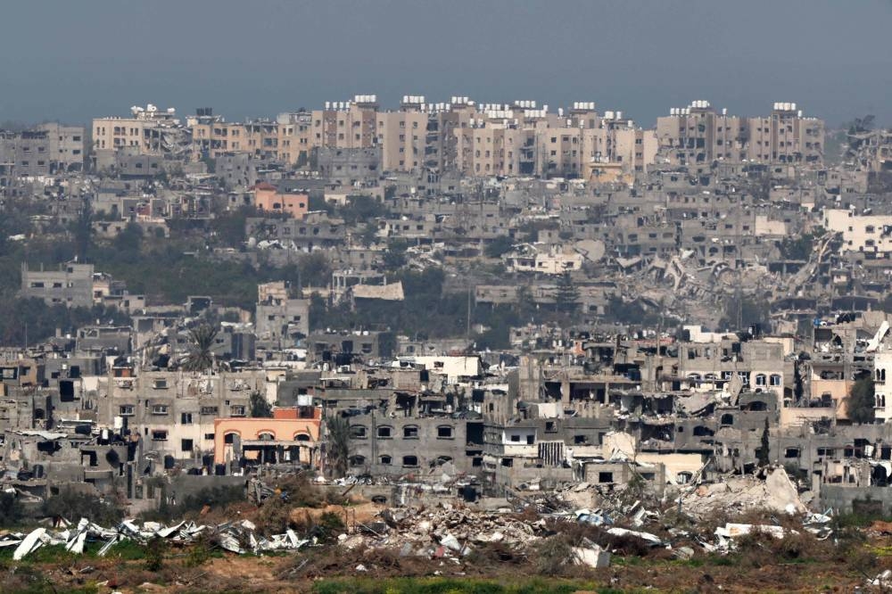 A picture taken from a position in southern Israel on Wednesday shows destroyed buildings in the Gaza Stri. AFP