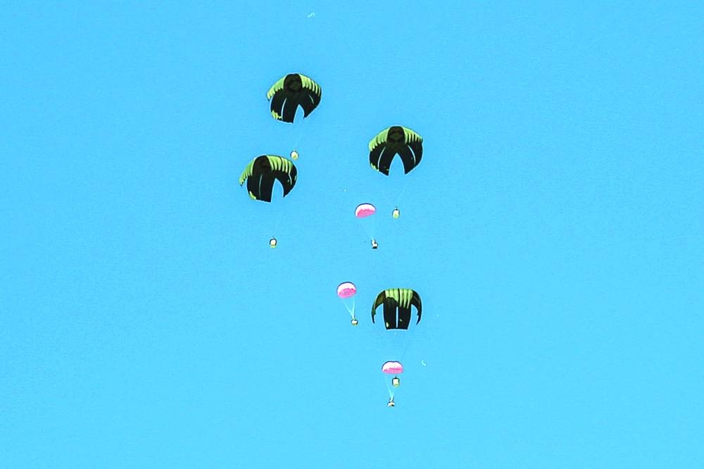 Aid parcels are airdropped over the northern Gaza Strip Friday.