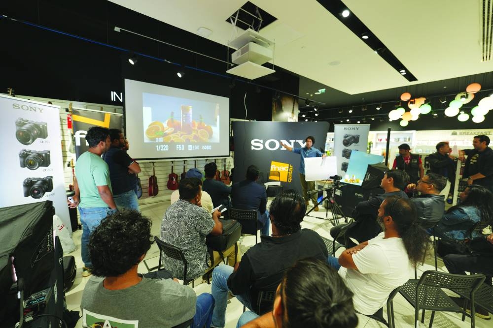 Gabr teaches participants how to compose and light a video setup at the workshop.