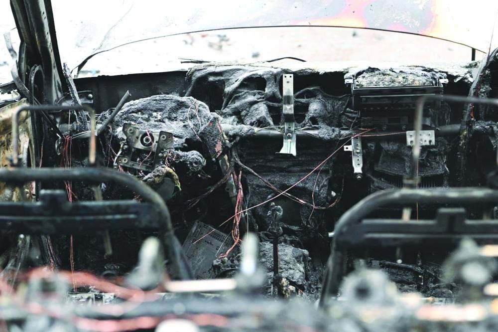 
The aftermath of fresh aerial attacks on Belgorod yesterday. Right: Presidential candidate, the Liberal-Democratic Party of Russia  leader Leonid Slutsky embraces his mother Natalia as they vote in Russia’s presidential election in Moscow. (AFP) 