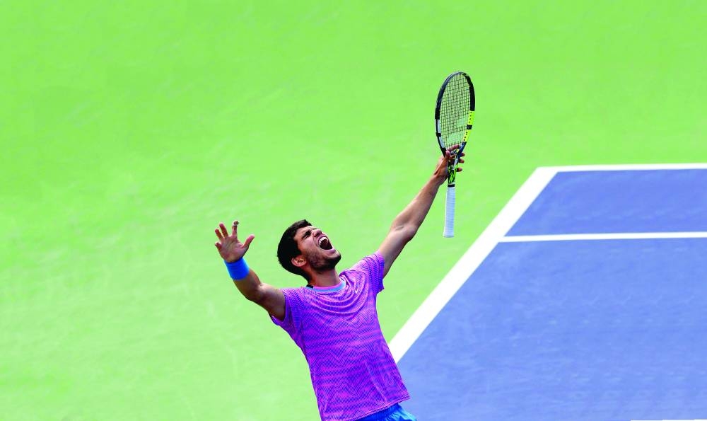 
Spain’s Carlos Alcaraz reacts after winning match point against Russia’s Daniil Medvedev in the Indian Wells Masters men’s final tennis match at the Indian Wells Tennis Garden in Indian Wells, California. (AFP) 