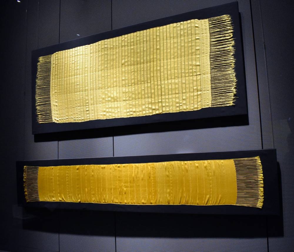 The spider silk-made textiles, along with historical manuscripts and folios detailing the meticulous process, are making their debut in the Middle East.