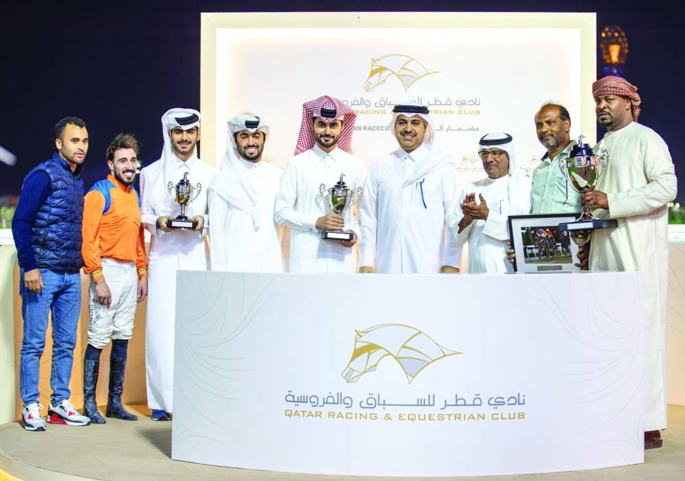 
Connections of Dubawi Spectre celebrate after the four-year-old bay gelding won the Al Jassasiya Cup at 
the Al Rayyan Racecourse. PICTURES: Juhaim 