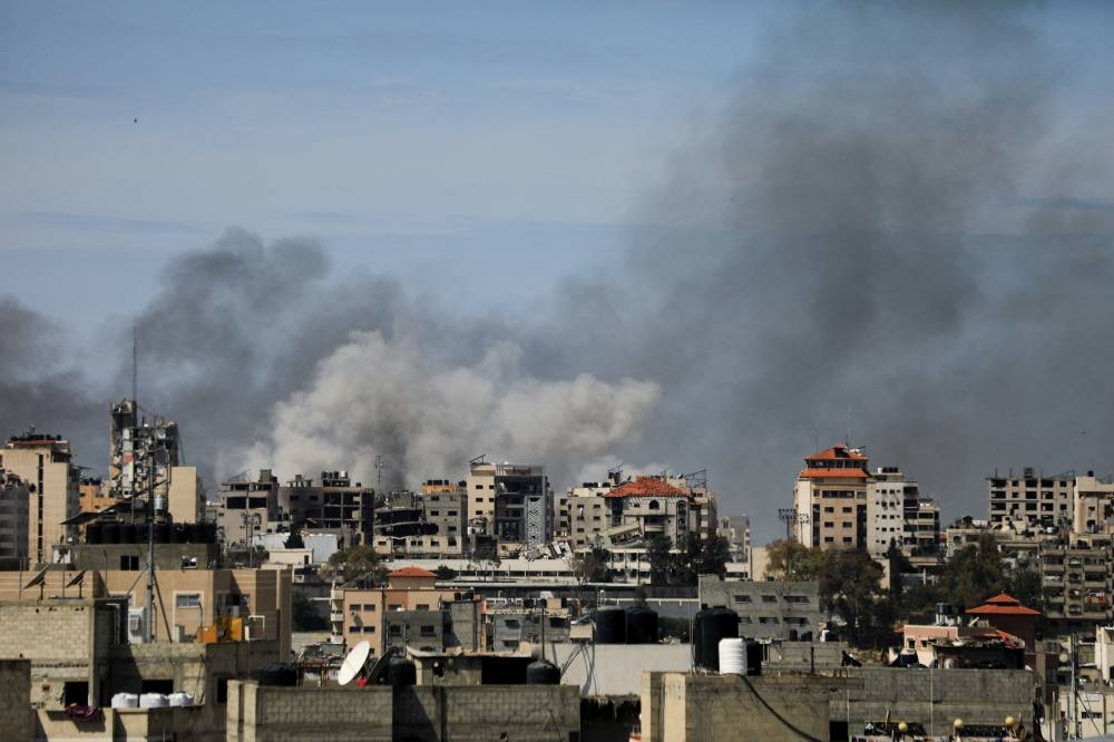 Smoke rises during an Israeli raid at Al Shifa hospital and the area around it, amid the ongoing conflict between Israel and the Palestinian Islamist group Hamas, in Gaza City, on Thursday. REUTERS