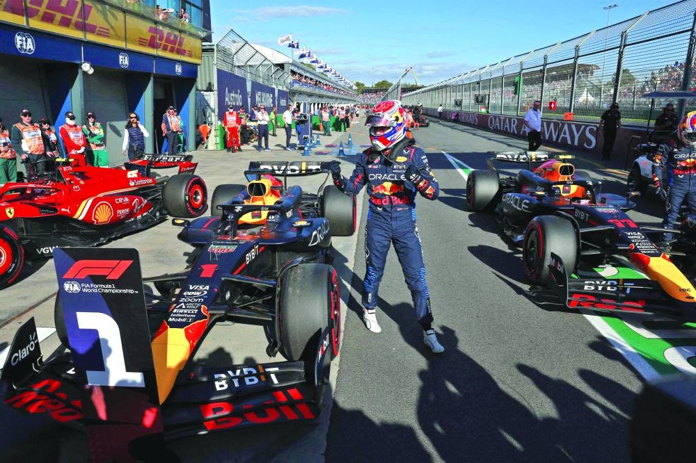 Red Bull Racing’s Dutch driver Max Verstappen celebrates after winning the pole position in the qualifying session of the Formula One Australian Grand Prix at the Albert Park Circuit in Melbourne on Saturday. (AFP)