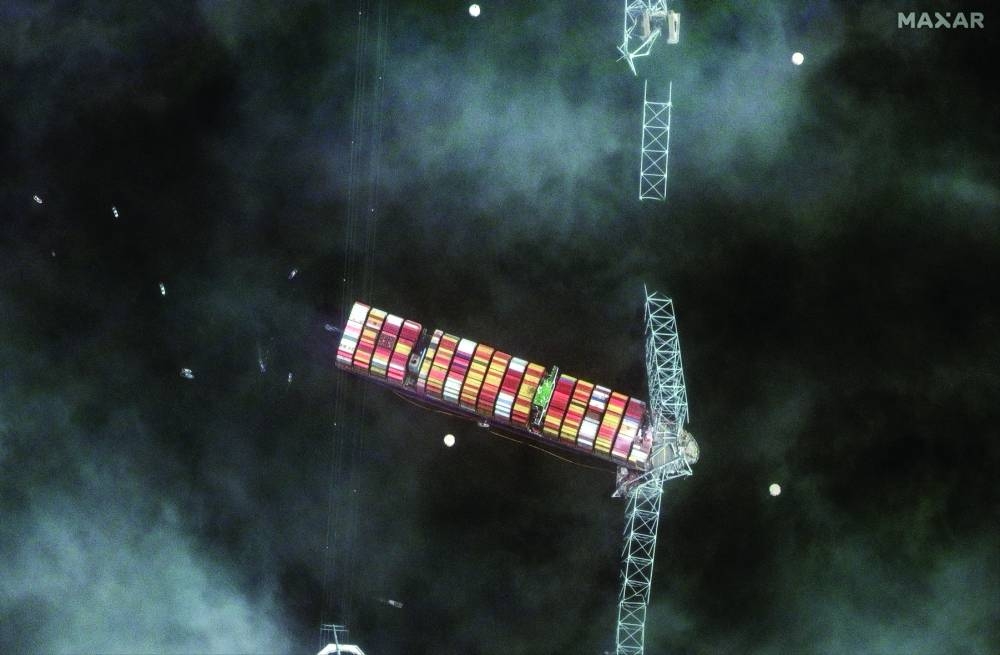 A satellite image shows a closer view of the Dali and collapsed bridge. (Reuters)