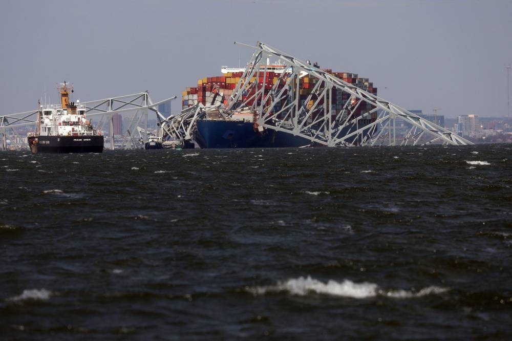 Wreckage from the Francis Scott Key Bridge rests on the Dali cargo ship on Friday in Baltimore, Maryland. AFP