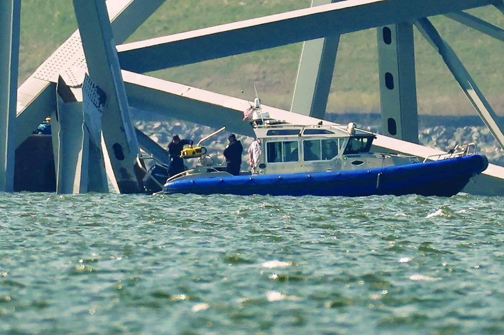 
A search team uses a remotely operated underwater vehicle to look at the wreckage of the Francis Scott Key Bridge, which was destroyed when a cargo ship collided with it earlier this week, in Baltimore, Maryland. 