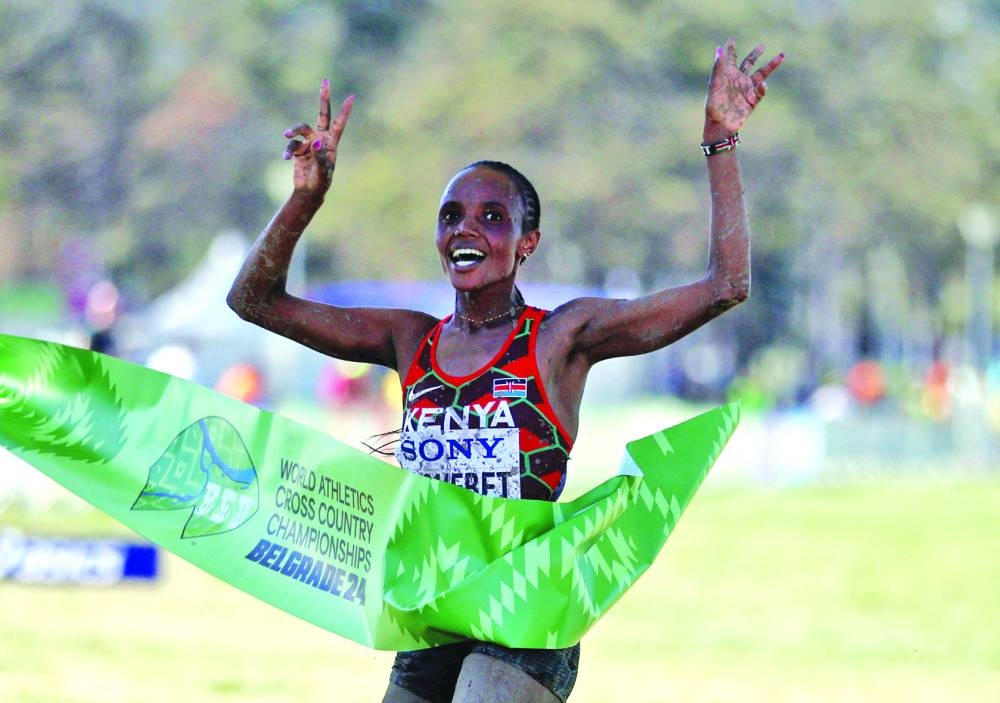 Kenya's Beatrice Chebet crosses the line to win the women's race at World Cross Country Championships in Belgrade. (Reuters)
