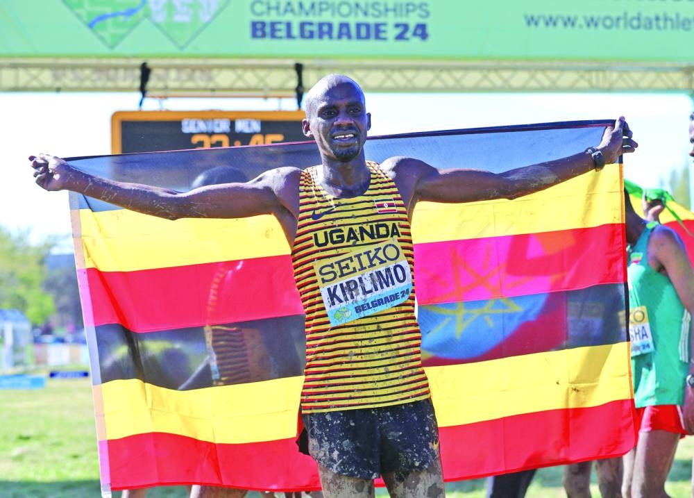 Uganda’s Jacob Kiplimo and Kenya’s Beatrice Chebet (right) celebrate after winning World Cross Country Championships men’s and women’s titles respectively in Belgrade on Saturday. (Reuters)