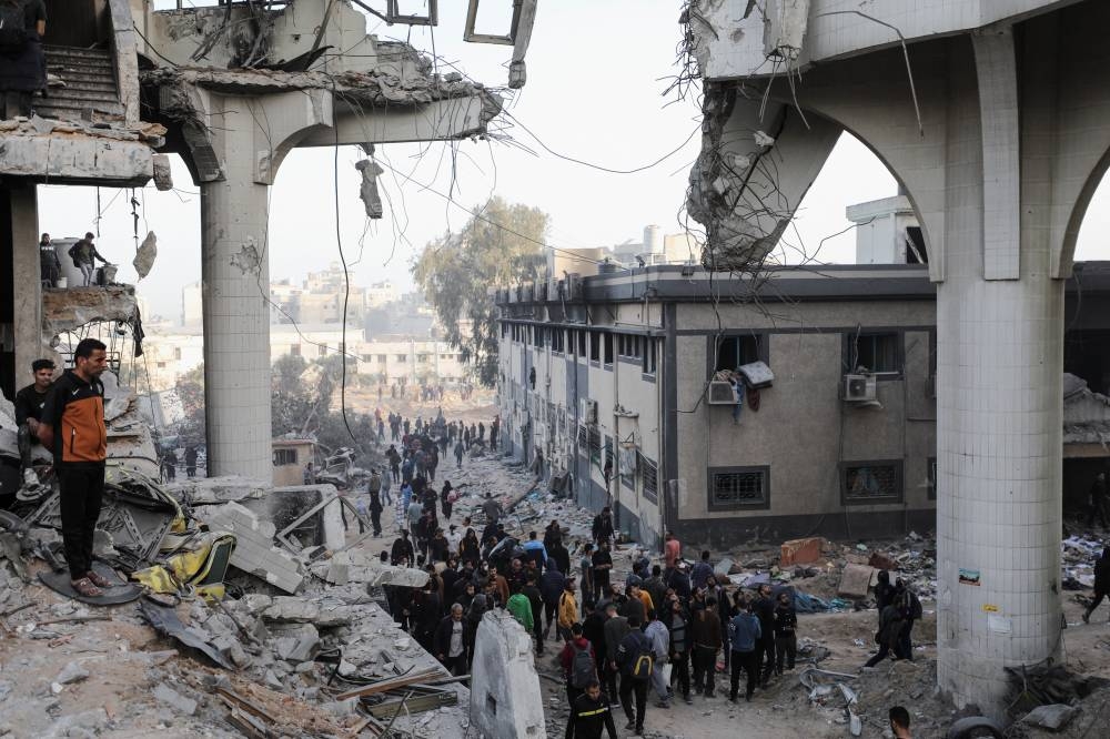 Palestinians inspect damages at Al Shifa Hospital after Israeli forces withdrew from the Hospital and the area around it. REUTERS