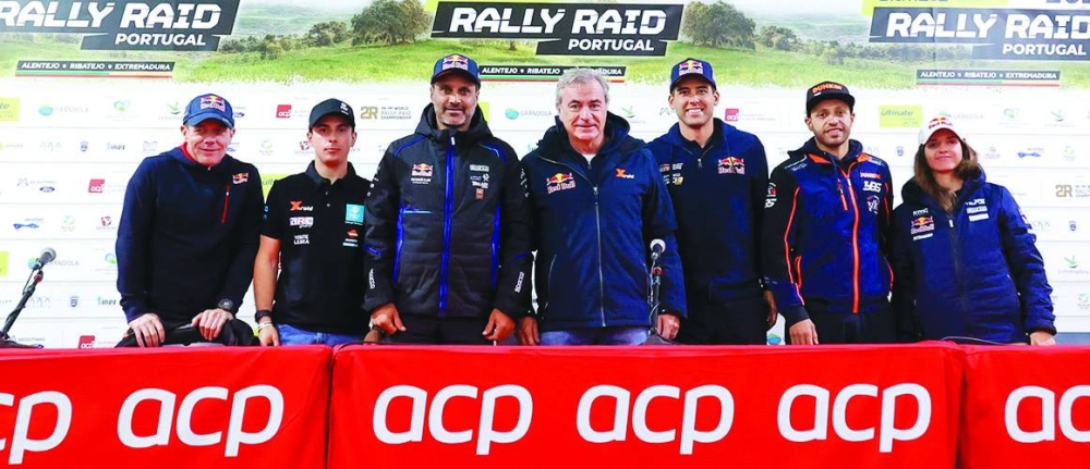 Nasser al-Attiyah poses with the his fellow competitors after the press conference for the Rally-Raid Portugal in Granola on Tuesday.