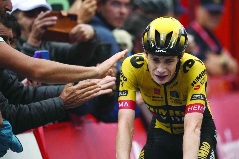 Team Jumbo-Visma’s Danish rider Jonas Vingegaard crosses the finish line in first place during the stage 16 of the 2023 La Vuelta cycling tour of Spain on September 12, 2023. Vingegaard broke his collarbone and ribs in Basque crash on Thursday. (AFP)