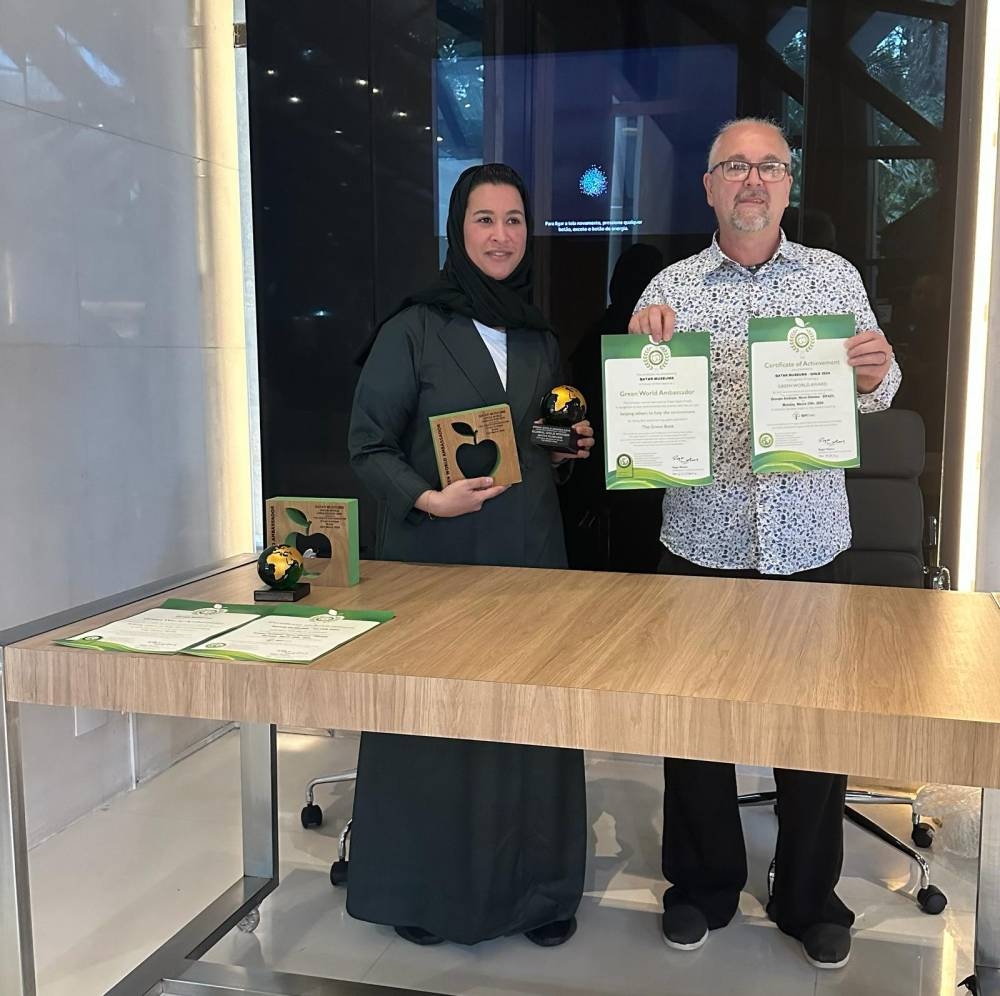 QM officials with the awards.