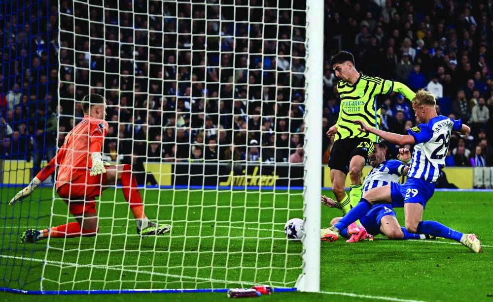 Arsenal’s Kai Havertz (centre) scores against Brighton during the Premier League match on Saturday, (Reuters)