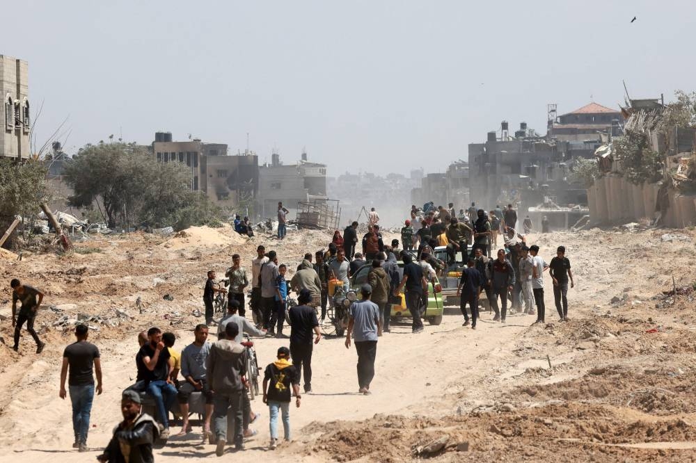 Palestinians who had taken refuge in Rafah, leave the city to return to Khan Yunis after Israel pulled its ground forces out of the southern Gaza Strip, on Sunday, six months into the devastating war. AFP
